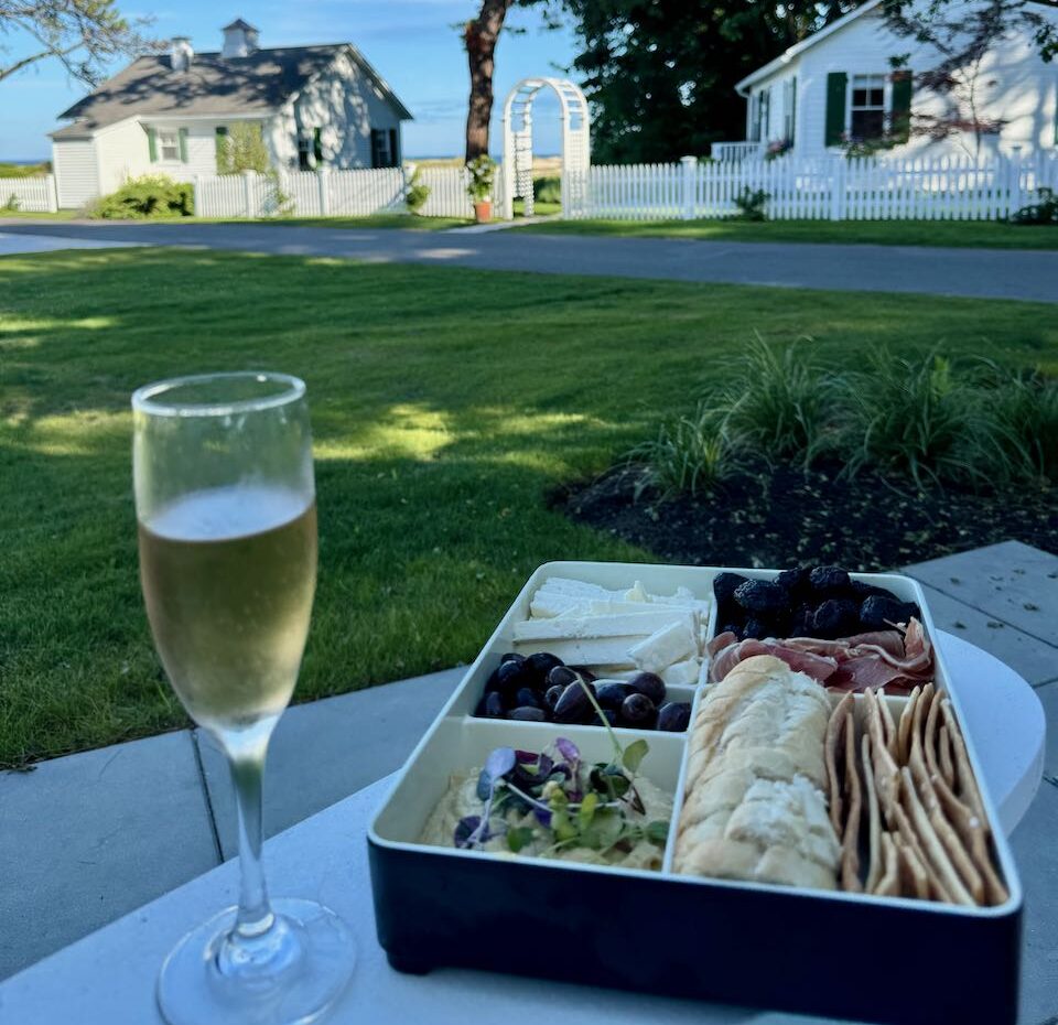 Mediterranean box and glass of rose on patio table