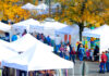 Images shows craft vendors tents at the annual free family-oriented fun Freeport Fall Festival